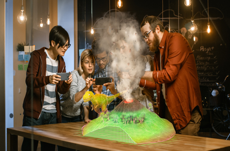 Group,Of,Young,Developers,Look,At,Dinosaur,And,Volcano,Eruption