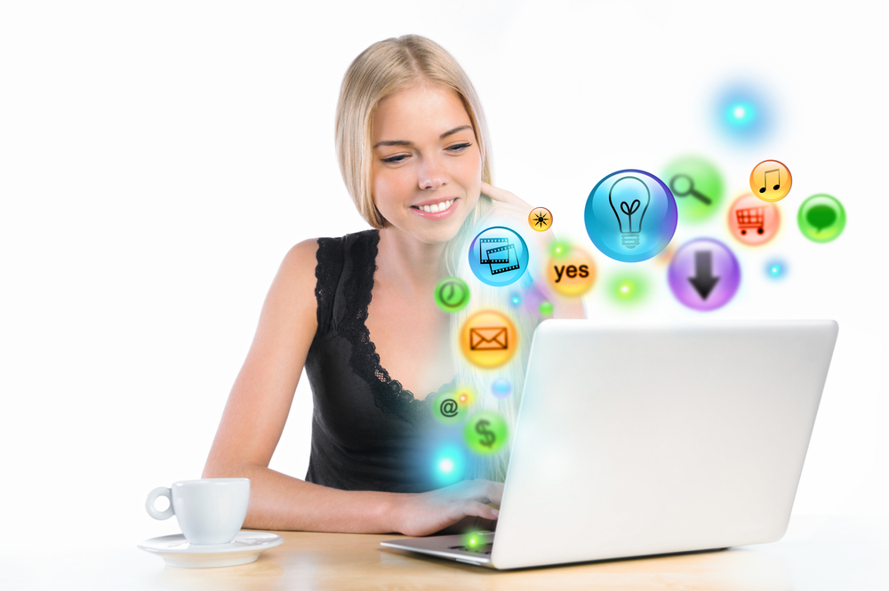 Young,Woman,Using,Her,Laptop,For,Multimedia,And,Site,Surfing.