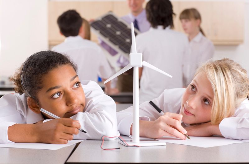 School,Girls,Writing,A,Report,On,Wind,Turbines,In,A