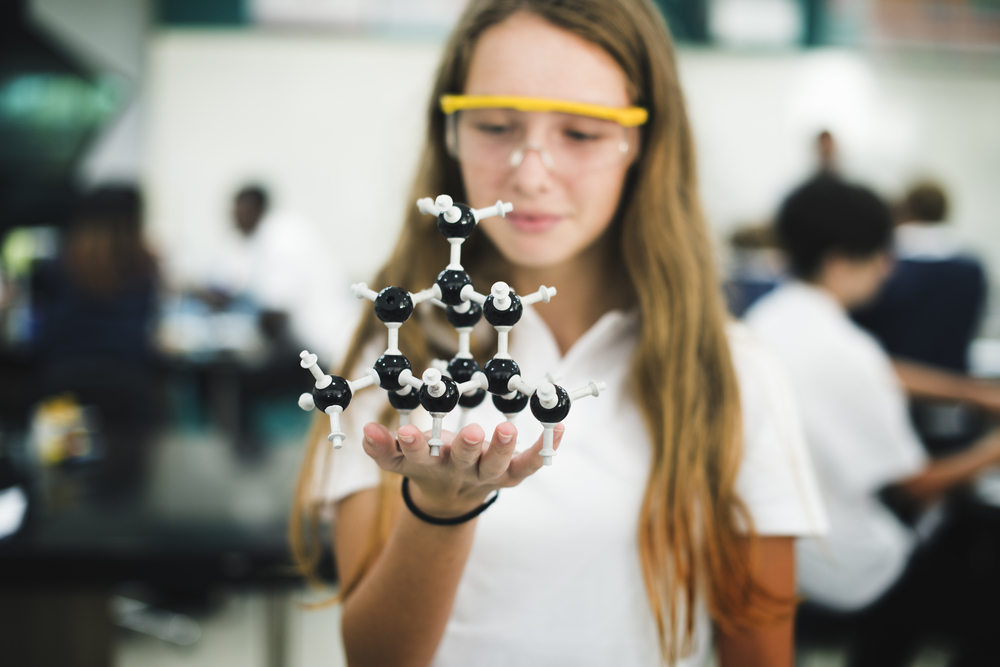 High,School,Student,Hand,Holding,Molecule,Structure,In,Chemistry,Class
